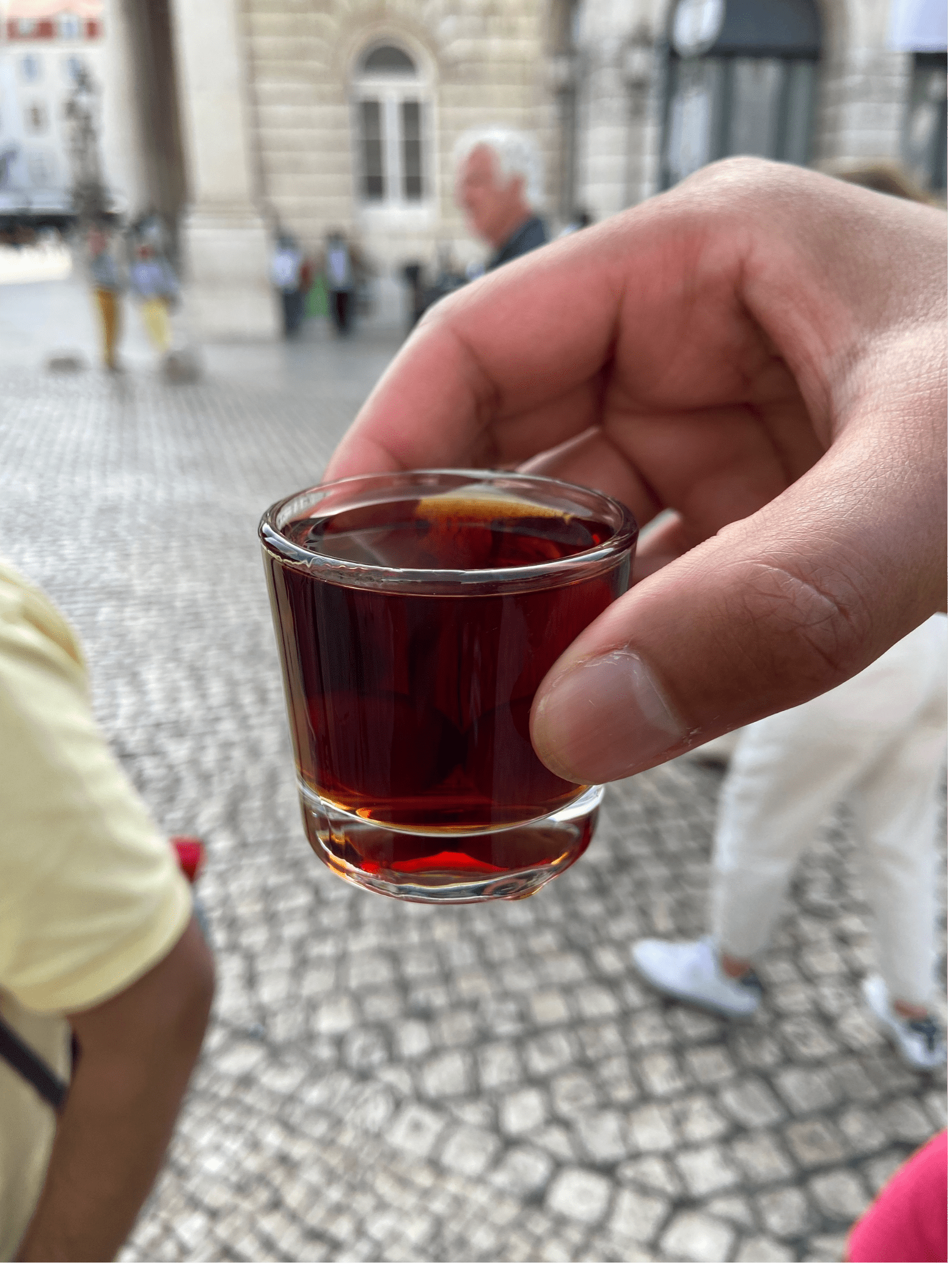 a glass with a red cherry alchohol