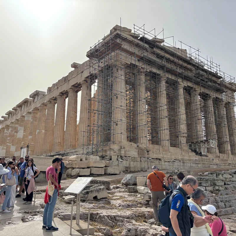 Front view of the Acropolis with people.