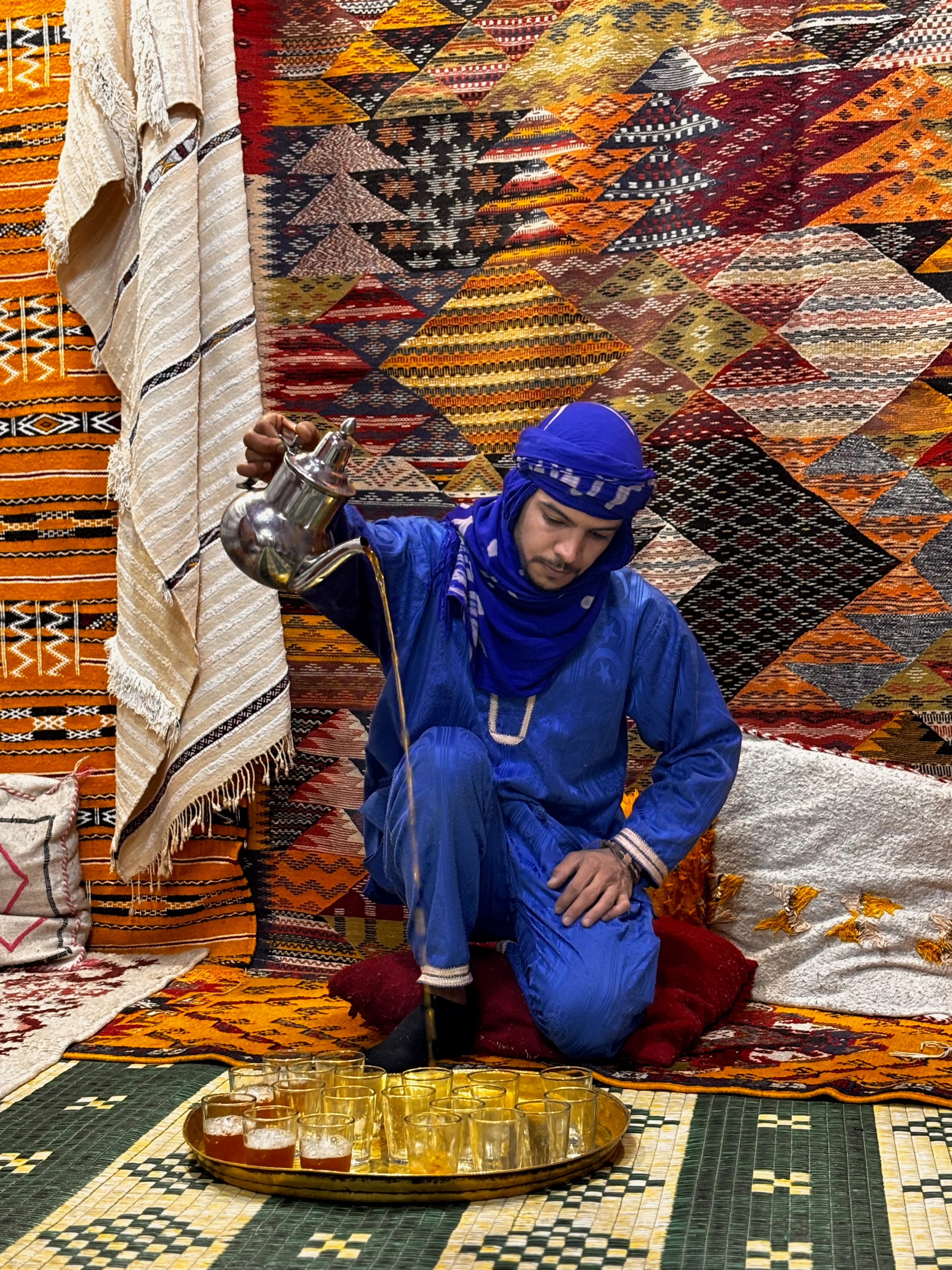 A man pouring tea