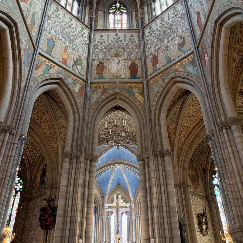 At the front of the cathedral.